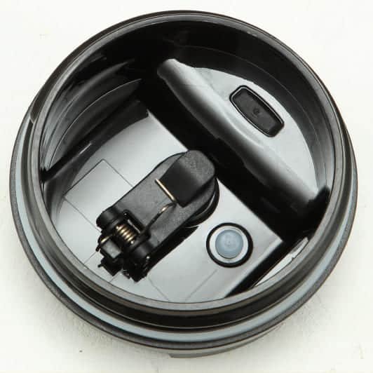 A flexible straw insertion into the self sealing gasket showing how the silicone valve opens smoothly for upright drinking.