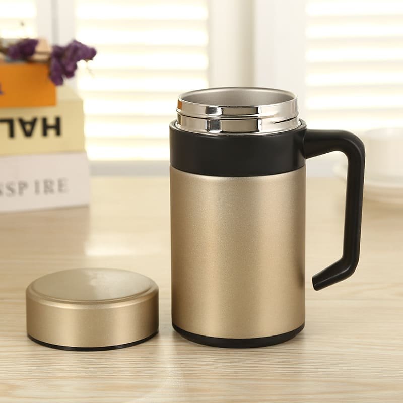 A clean standalone product shot of the champagne gold office insulated mug with black handle isolated on a white background.