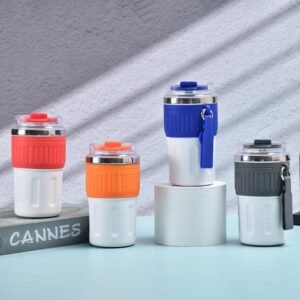 Four carry loop coffee mugs in red, orange, blue, and gray colors showcasing textured silicone sleeves and side transport straps.