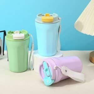 Wholesale group image of contrast color insulated travel coffee tumbler in blue, green, and lavender matte coatings with custom carrying straps.