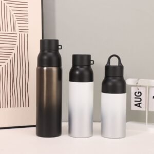 Three different sizes of dual-lid stainless steel travel mugs displayed in a professional setting.