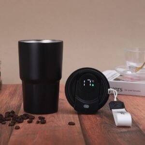 Wholesale 450ml smart LED temperature display coffee cup in matte black with touch activated lid lying beside