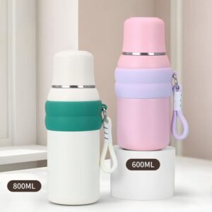 Wholesale 600ml and 800ml travel vacuum flask with cup lid dual-purpose in white and pink standing side by side.