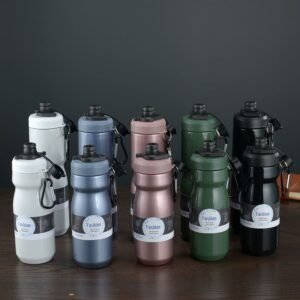 Wholesale collection of insulated bicycle water bottles in matte powder coated finishes aligned for professional sports team bulk orders.