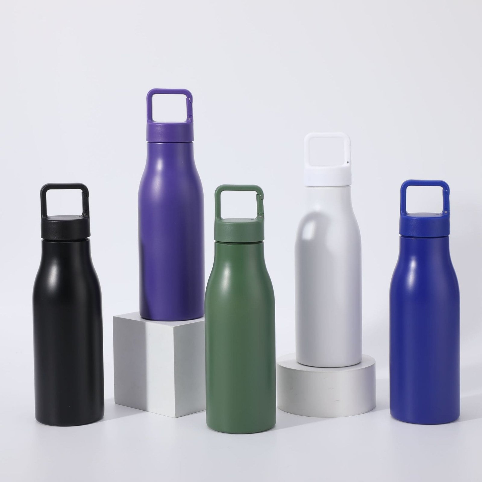 Wholesale single wall stainless steel water bottle 700ml lineup featuring purple black green white and blue powder coating