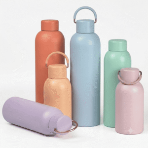 Wholesale morandi vacuum insulated sports bottle cozy set, showcasing thin mint dusty tangerine soft coral sand blue and matte black Matte Powder Coated water flasks in 350ml 500ml 750ml capacities isolated on a marble stand.